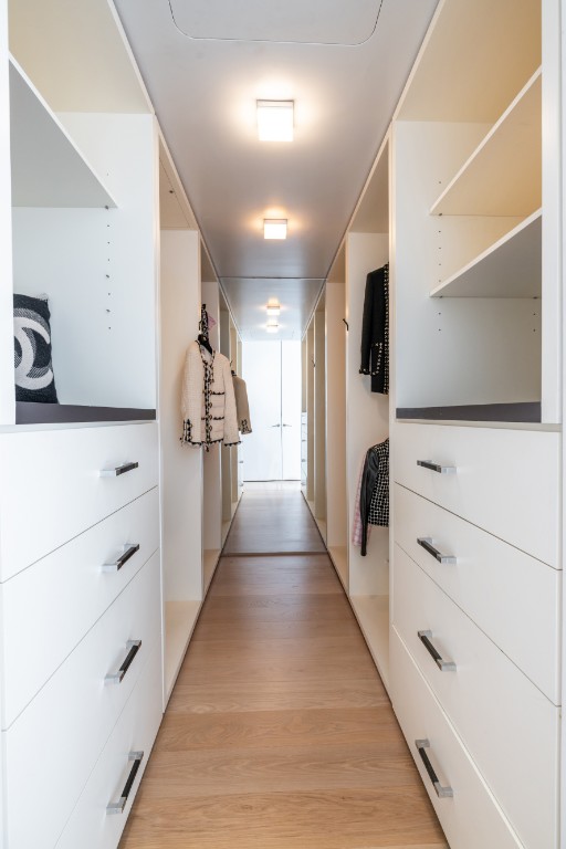 spacious closet featuring light wood finished floors