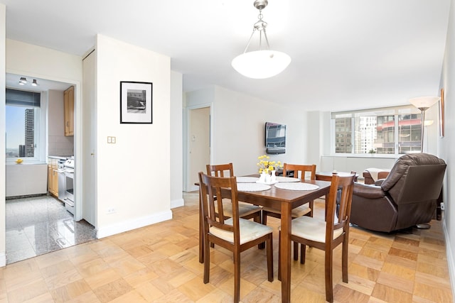 dining room with baseboards
