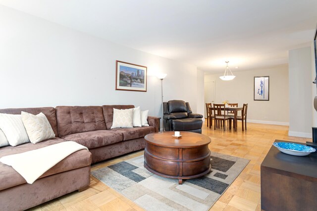 living room featuring light parquet flooring