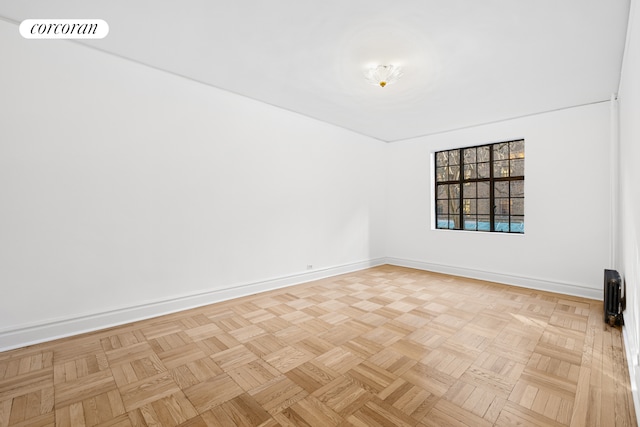 unfurnished room featuring baseboards and visible vents