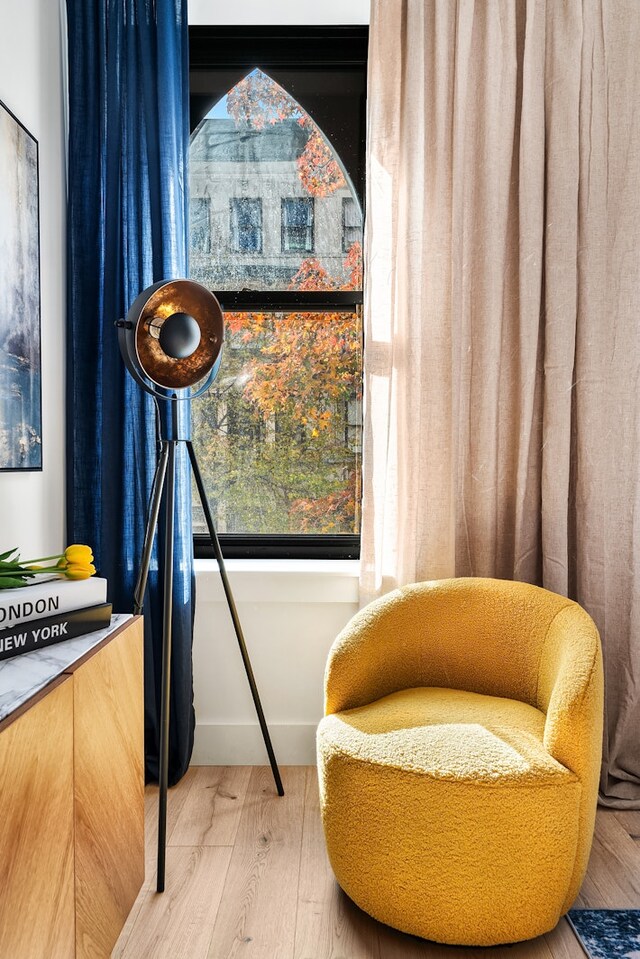 sitting room with wood-type flooring