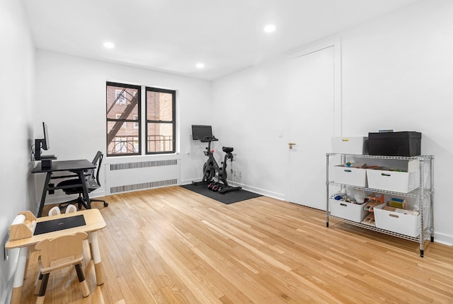 office featuring hardwood / wood-style flooring and radiator