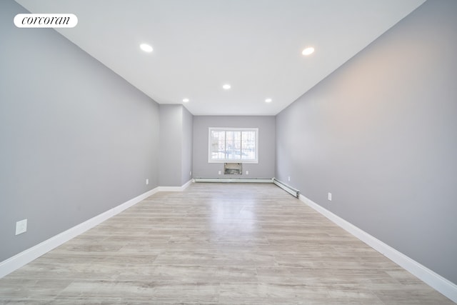 empty room featuring light wood-style flooring, recessed lighting, baseboards, and visible vents