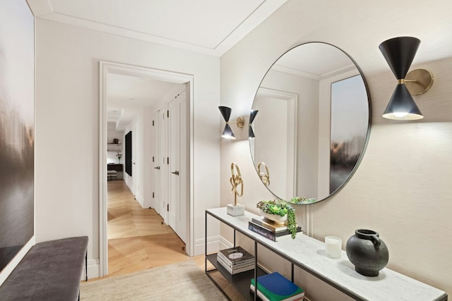 hall with crown molding and light hardwood / wood-style floors