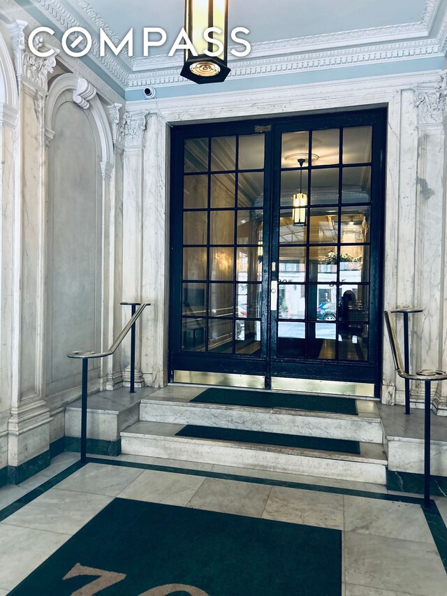 entrance to property featuring french doors