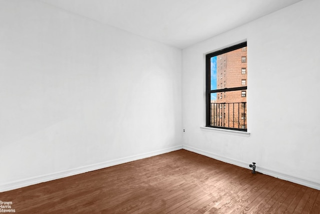 empty room featuring dark hardwood / wood-style flooring