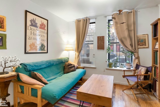 living room with wood finished floors and baseboards