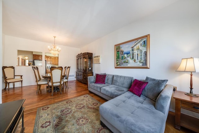 living room featuring hardwood / wood-style flooring and a notable chandelier