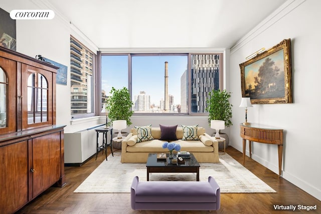 sitting room with baseboards, a view of city, and visible vents