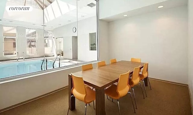 dining area featuring visible vents, recessed lighting, and carpet flooring