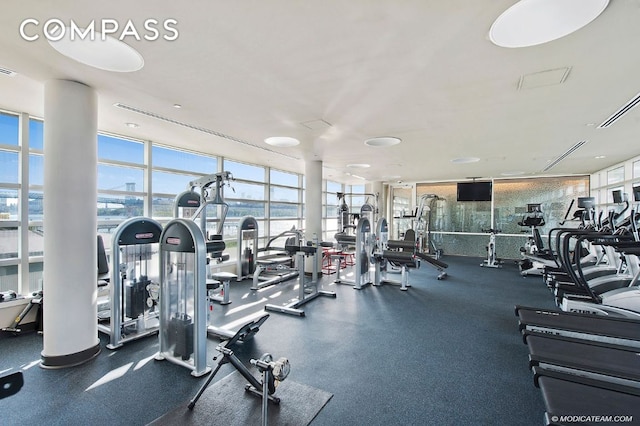 gym with floor to ceiling windows