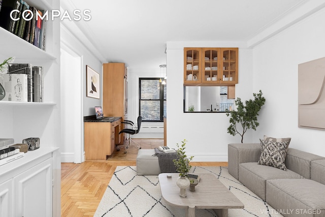 living area featuring baseboards