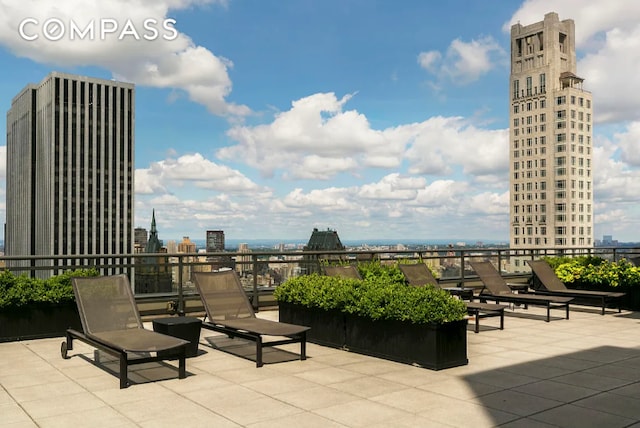 view of patio / terrace featuring a city view