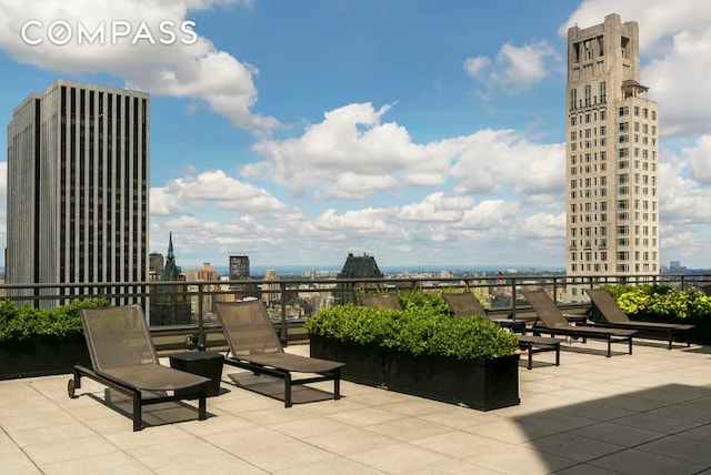 117 E 57th St Unit 35D, New York City, NY 10022 - view of patio featuring a city view