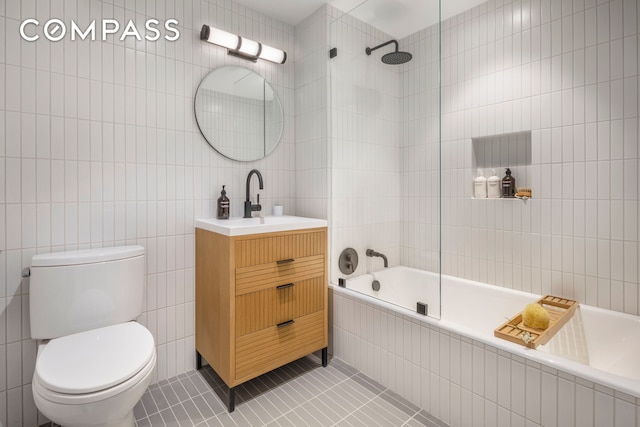 111 Montgomery Street Garden B, New York City, NY 11225 - bathroom with tile walls, tile patterned flooring, toilet, vanity, and tiled shower / bath