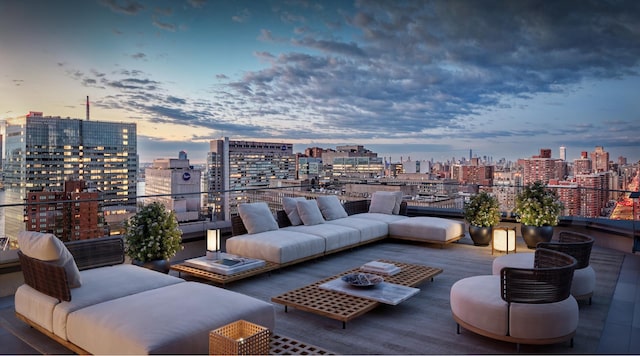 patio terrace at dusk featuring an outdoor living space and a view of city