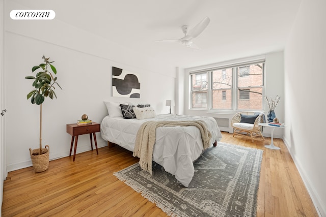 bedroom with ceiling fan and hardwood / wood-style floors