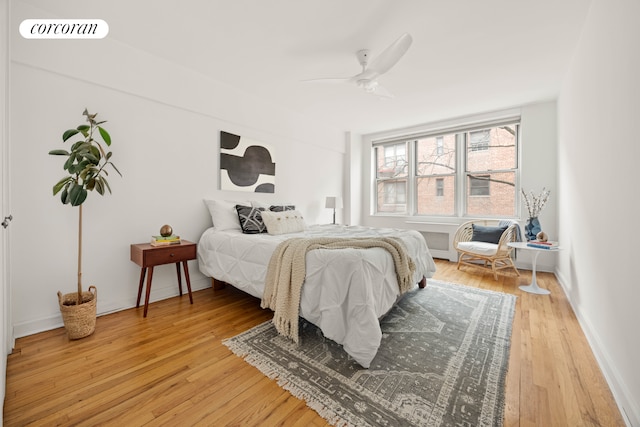 415 Argyle Rd Unit 5U, New York City, NY 11218 - bedroom with light wood-style floors, a ceiling fan, and baseboards