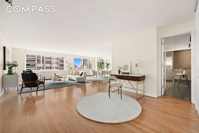 living area with wood finished floors and a wealth of natural light