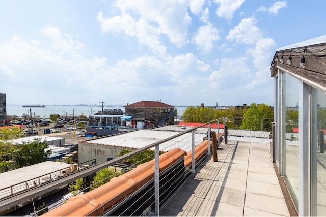 balcony featuring a water view