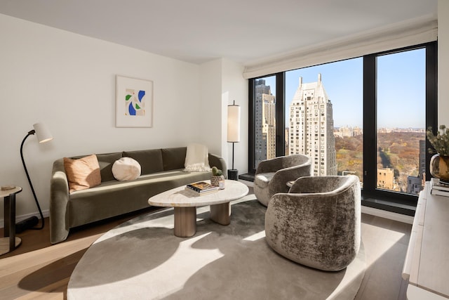 living room with a city view and wood finished floors