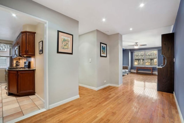 hallway with light wood-type flooring