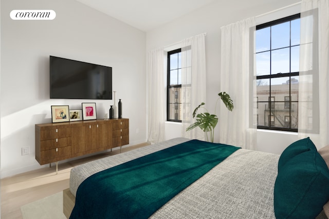 bedroom with light wood-type flooring