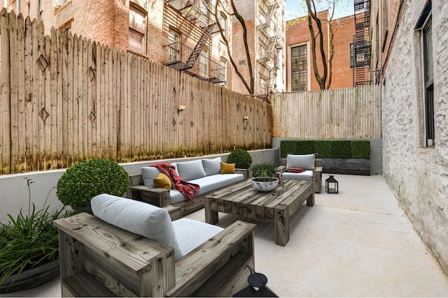 view of patio with outdoor lounge area and fence