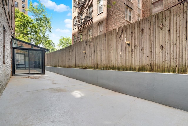 view of patio / terrace featuring fence