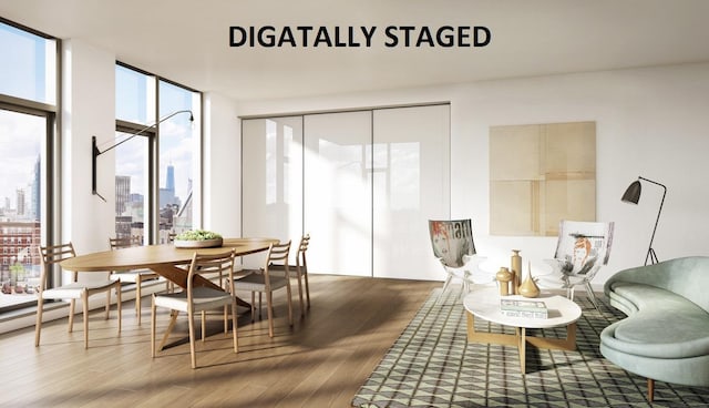 dining room featuring a view of city, a wall of windows, and wood finished floors