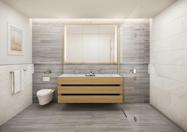 bathroom featuring vanity, toilet, and tile walls