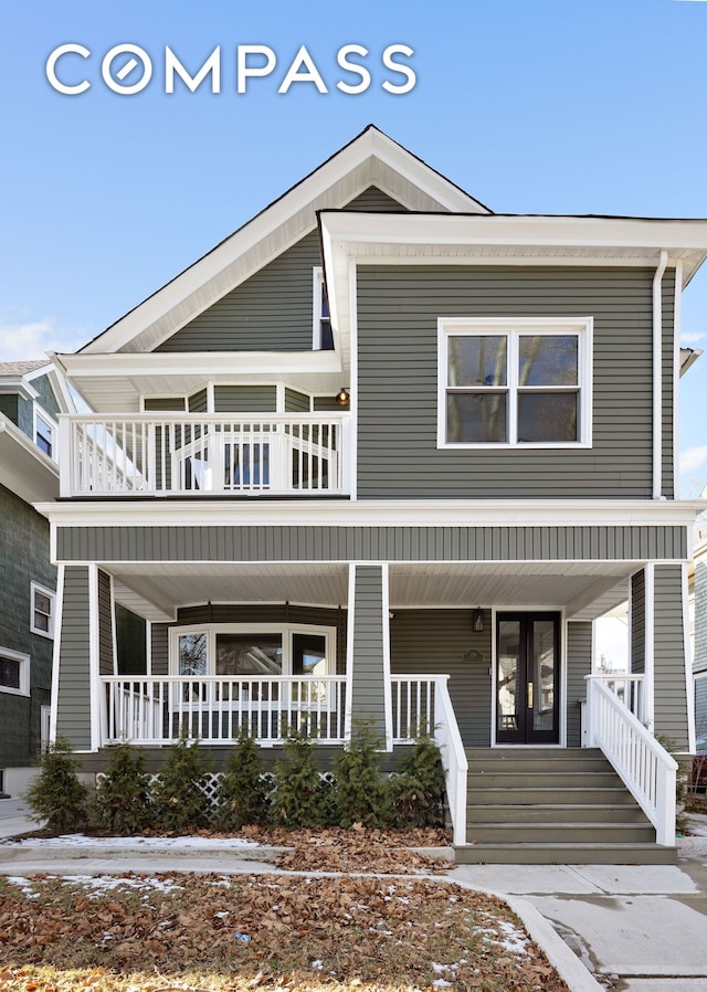 view of front of home featuring covered porch and a balcony