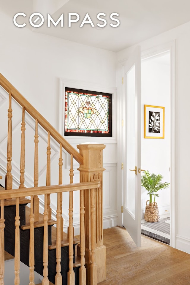 stairs with wood finished floors