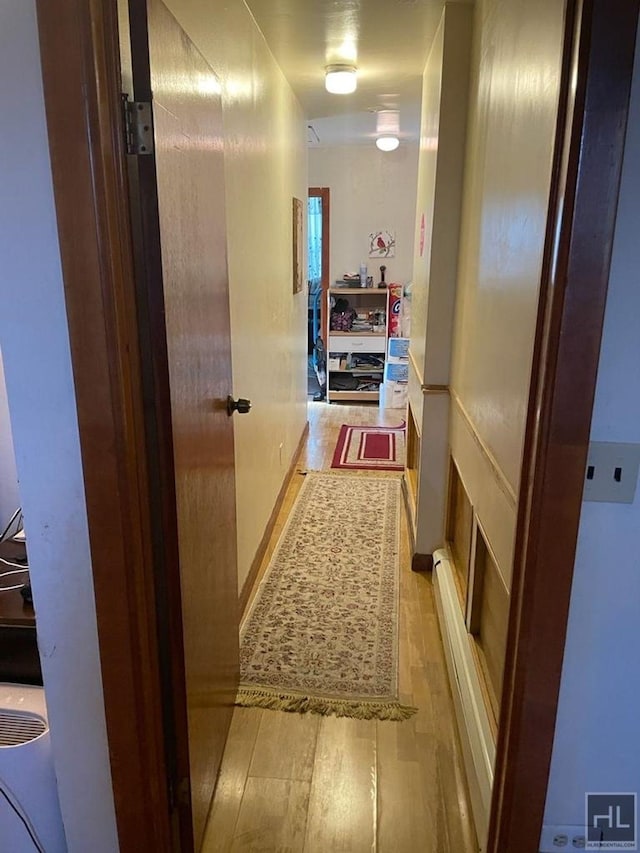 corridor featuring wood finished floors