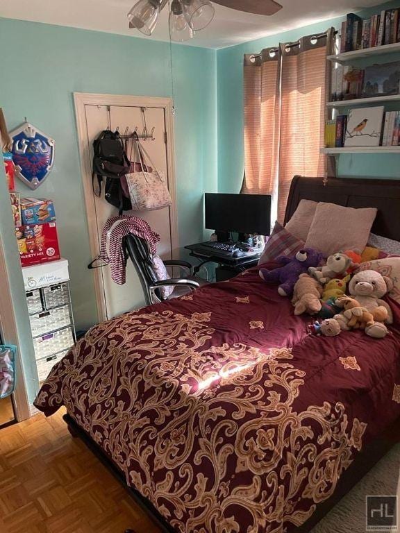 bedroom featuring a ceiling fan and a closet