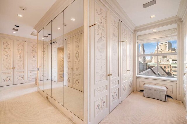 dining room with a notable chandelier, crown molding, and hardwood / wood-style floors