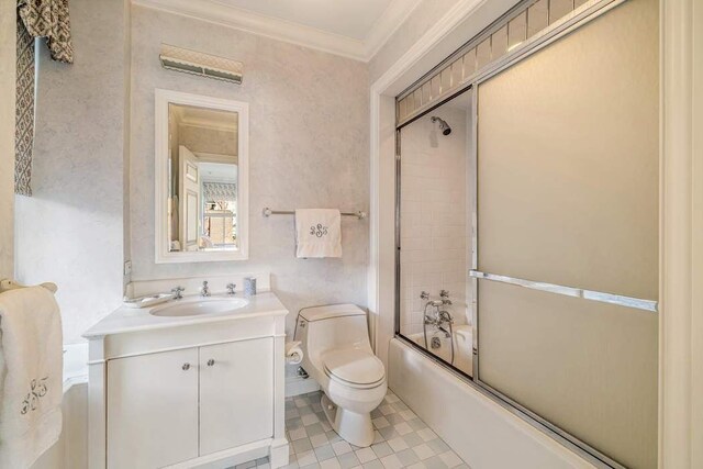 bathroom with crown molding, vanity, a chandelier, and toilet