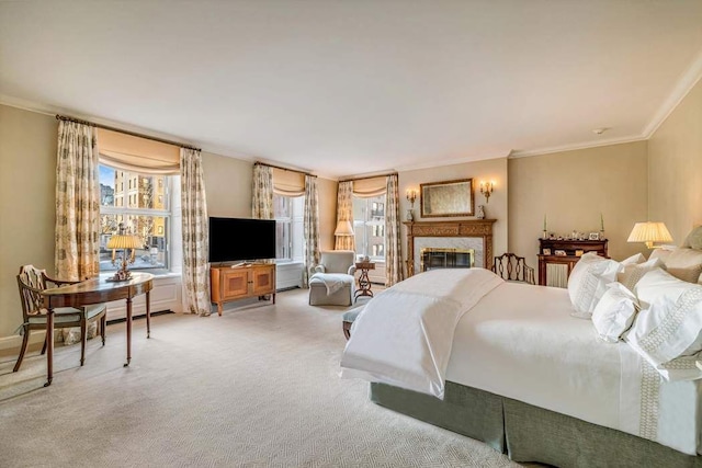 bedroom with ornamental molding and carpet floors