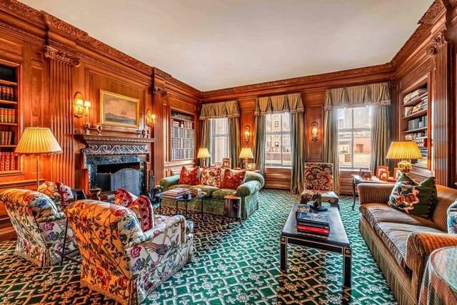 living room featuring crown molding, light wood-type flooring, and a chandelier