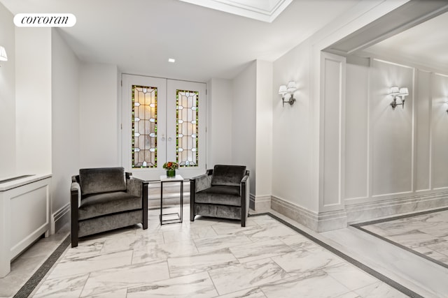 living area with a skylight and french doors