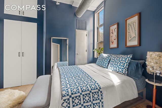 bedroom featuring visible vents and a closet