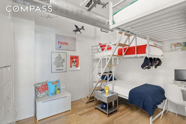 bedroom featuring hardwood / wood-style flooring