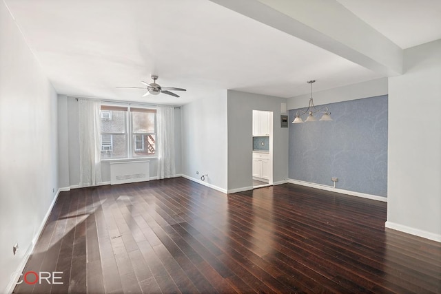 spare room with dark wood-type flooring and ceiling fan