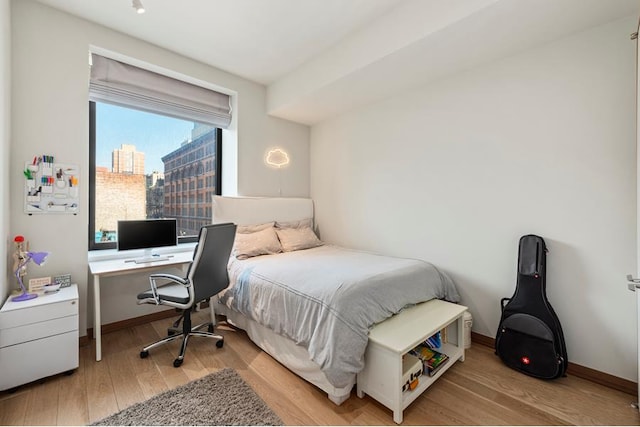 bedroom featuring light wood-type flooring