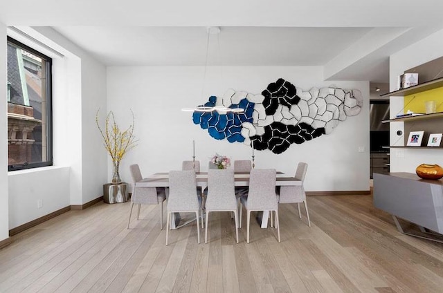 dining space featuring light wood-type flooring