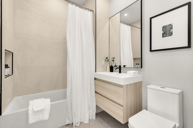 bathroom with toilet, shower / bath combo with shower curtain, and vanity