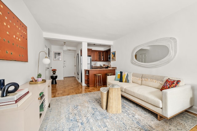 living room featuring parquet flooring