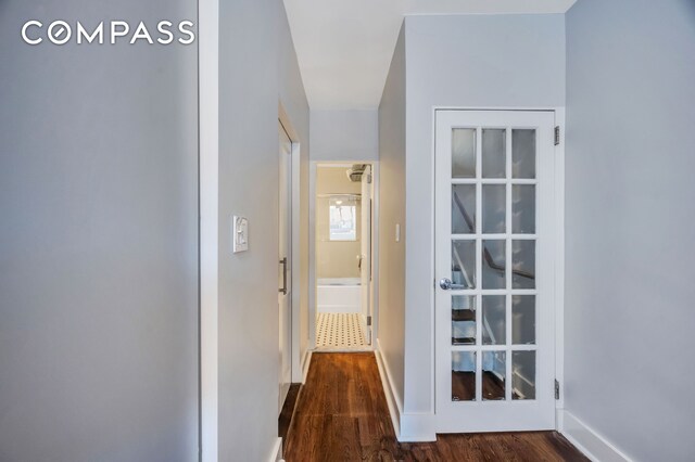 hallway featuring dark hardwood / wood-style floors