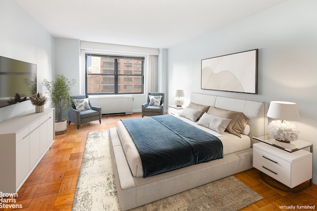 bedroom featuring light parquet floors