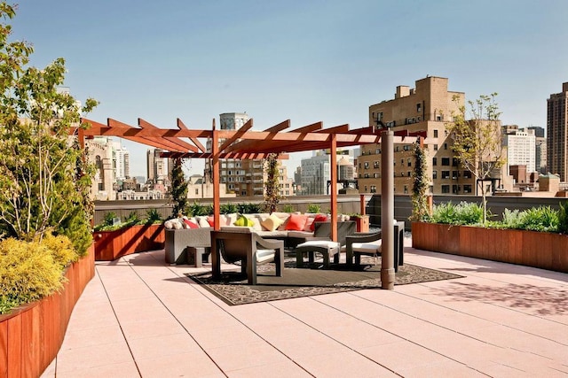 view of patio with outdoor lounge area and a pergola